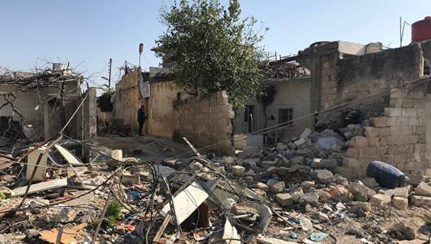 Последствия обстрела турецкими военными поселения Дженджерес в кантоне Африн на севере Сирии
