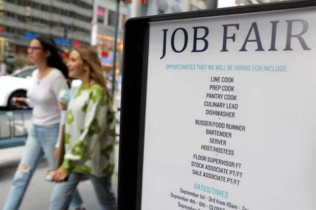 Signage for a job fair is seen on 5th Avenue after the release of the jobs report in Manhattan, New York City, U.S., September 3, 2021. REUTERS/Andrew Kelly