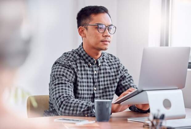 A person at a laptop.