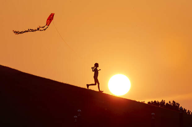 girl flying a kite at sunset by Hayri Kodal on 500px.com