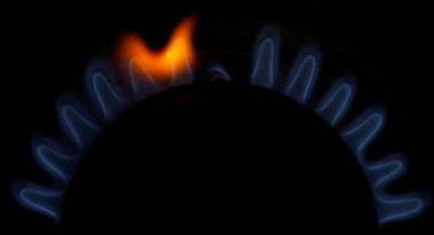 Flames come out of a domestic gas ring on a stove in Manchester, Britain, September 20, 2021. REUTERS/Phil Noble