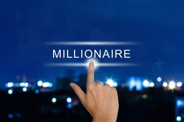 A finger pointing to the word millionaire.