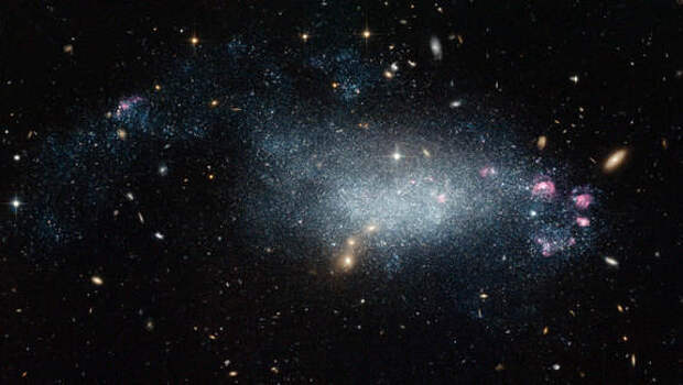 The nearby galaxy DDO 68, captured here in visible and infrared light, was thought to provide a glimpse of a young galaxy until recently.