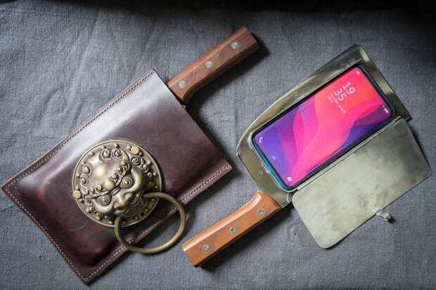 Cellphone cases designed to look like meat cleavers are Geng Shuaiâs hottest product. Heâs sold 10. (Yan Cong / The Washington Post)