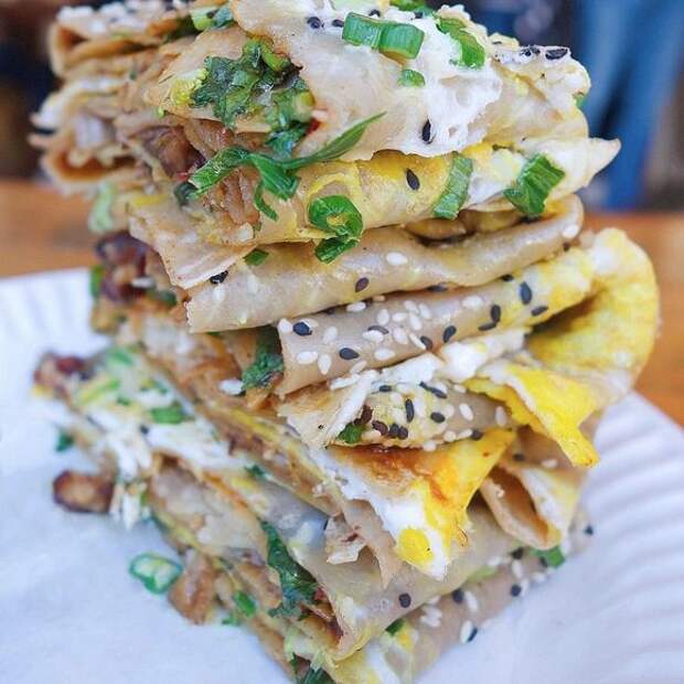 Eggs, hoisin sauce, chili, cilantro, sesame, crunchy wontons, and peking duck.