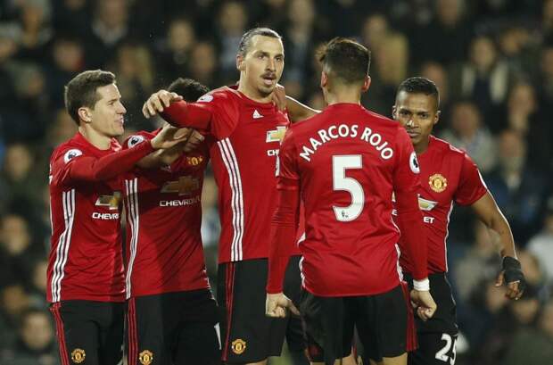 Manchester United's Zlatan Ibrahimovic celebrates scoring their second goal with team mates.