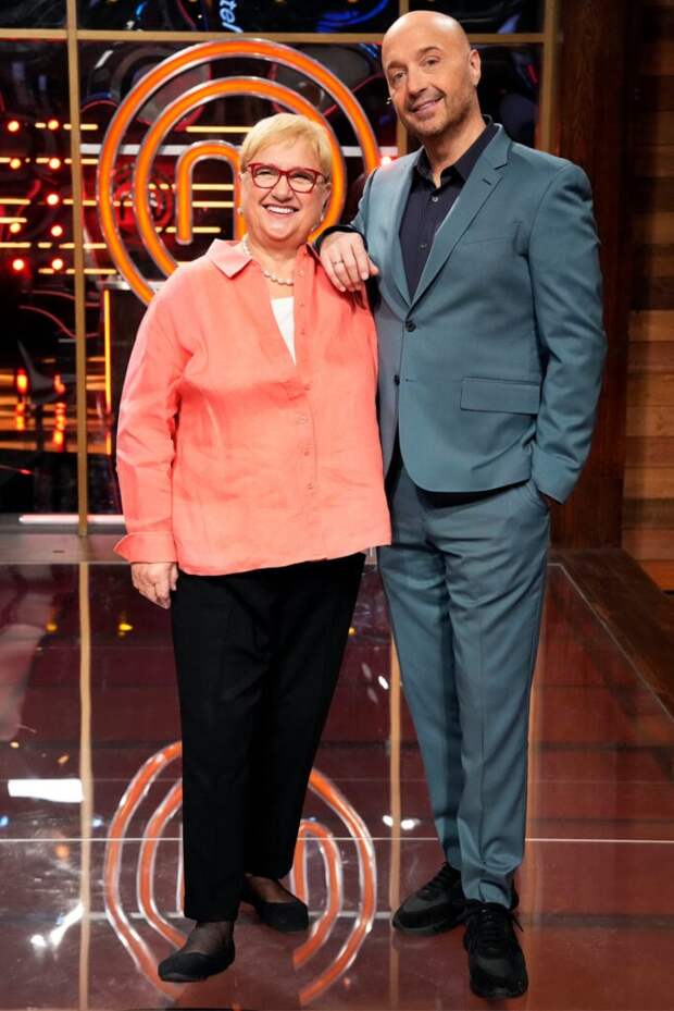 Joe smiles and poses with his mother, esteemed chef, author, and television personality, Lydia Bastianich.