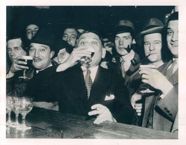 H.L. Mencken drinks his first swig of legal beer at Baltimore's Rennert Hotel on April 7, 1933.