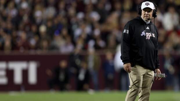 Jimbo Fisher coaches from the sidelines during a game between Texas A&M and Mississippi State.