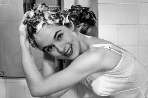 UNITED STATES - CIRCA 1950s:  Woman washing hair in bathroom sink.  (Photo by George Marks/Retrofile/Getty Images)