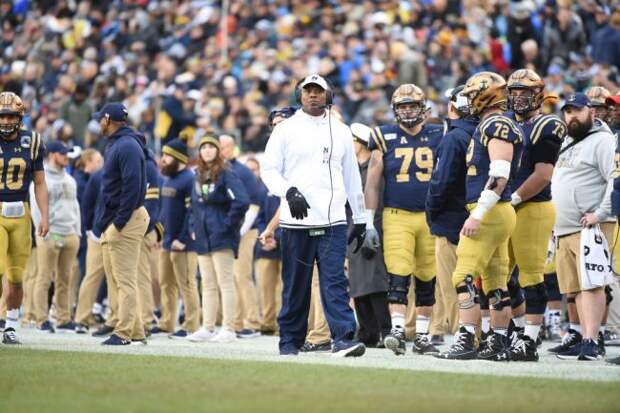 navy football fires rehires coach