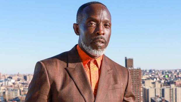 michael k williams posing on a rooftop