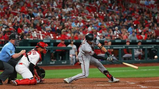 Nick Ahmed hits a double in a game against the Cardinals.