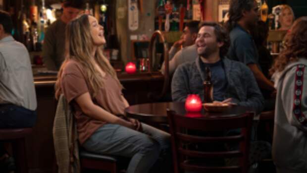 Lead photo for Grey's Anatomy S21E01. Jo and Schmitt laugh at Joe's bar.