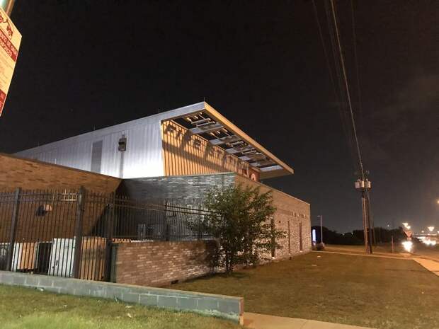 Firestation In My Town Uses Shadows Cast From A Nearby Streetlight To Create Its Sign