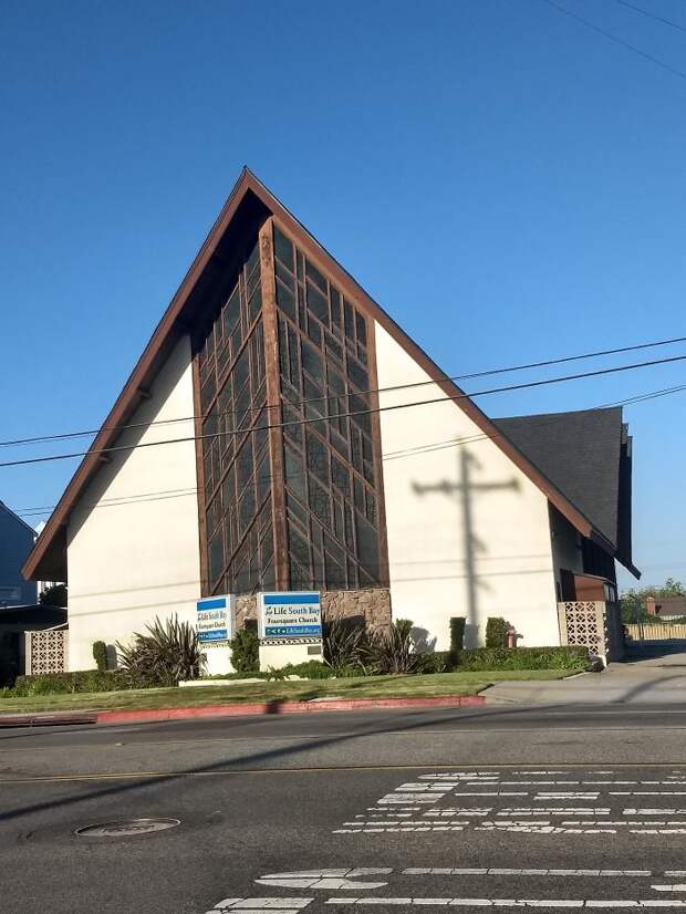 The Telephone Pole's Shadow Makes A Cross On The Church Across The Street