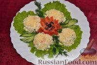 Фото к рецепту: Салат с кальмарами и крабовыми палочками