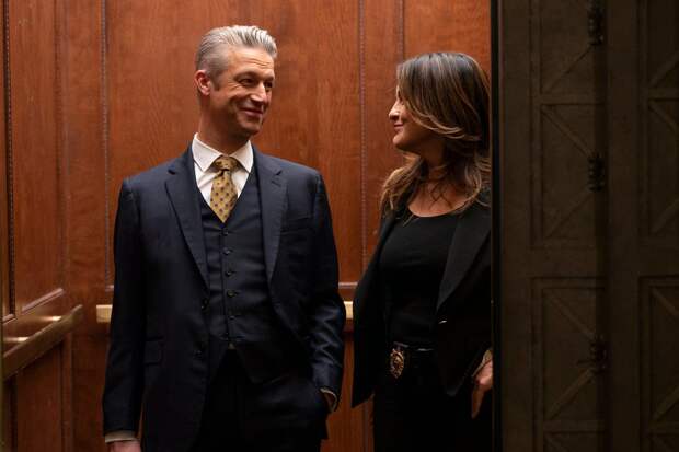 Benson and Carisi smile at each other in the elevator on Law & Order: SVU Season 26 Episode 15