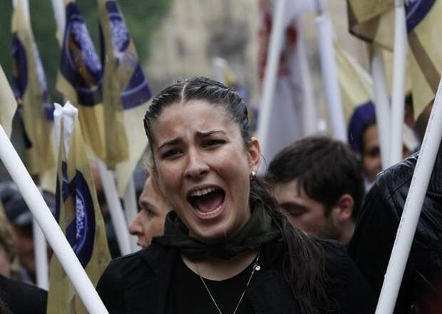 A supporter chants slogans during an opposition rally in central Tbilisi