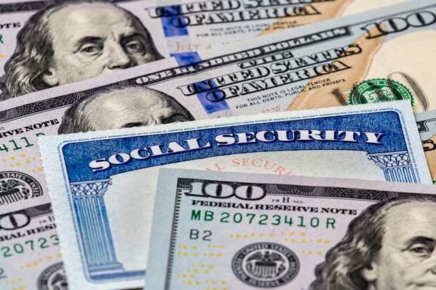 Social Security card with 100 dollar bills.
