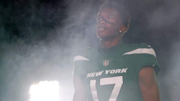 Garrett Wilson walks onto the field at MetLife Stadium.