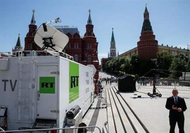 Vehicles of Russian state-controlled broadcaster Russia Today (RT) are seen near the Red Square in central Moscow, Russia June 15, 2018. Picture taken June 15, 2018. REUTERS/Gleb Garanich