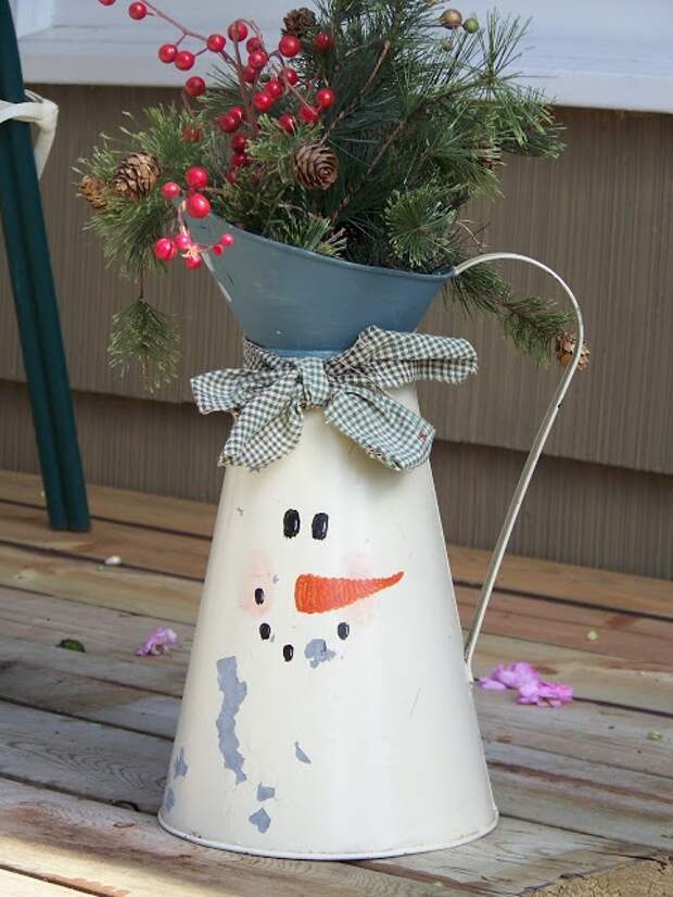 snowman painted watering can