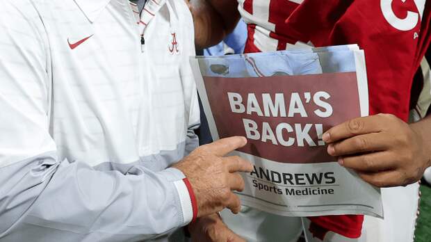 Nick Saban and James Smith hold Bamas Back newspaper