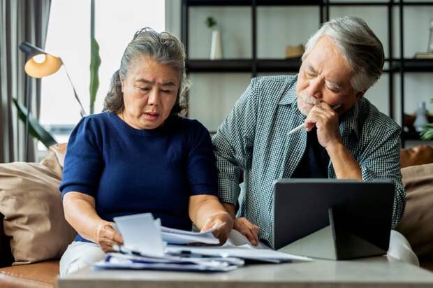 Two people looking at documents.