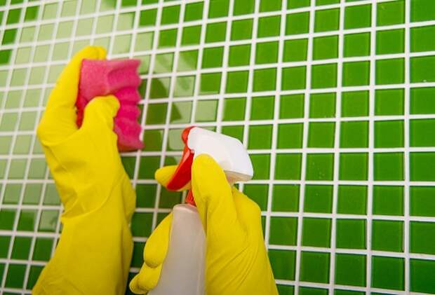 washing the tiles in the bathroom