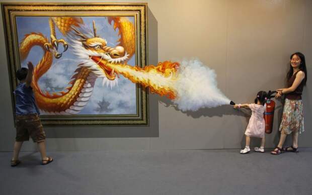 Members of a family pose for a photograph in front of a 3D painting at the 2012 Magic Art Special Exhibition in Hangzhou, Zhejiang province on July 7, 2012. (REUTERS / Carlos Barria)