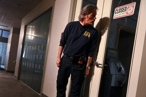 Vince peeks through a window