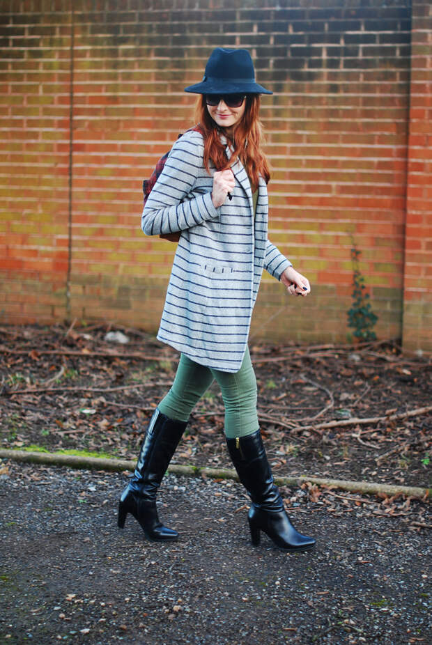 Striped longline blazer with black boots, plaid rucksack and fedora