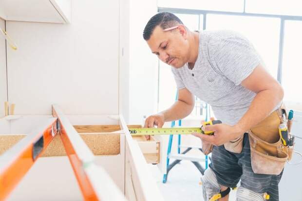 A contractor working on a kitchen renovation.