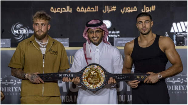 Jake Paul and Tommy Fury posing with WBC belt