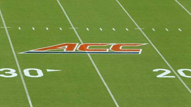 A ACC logo on the football field.