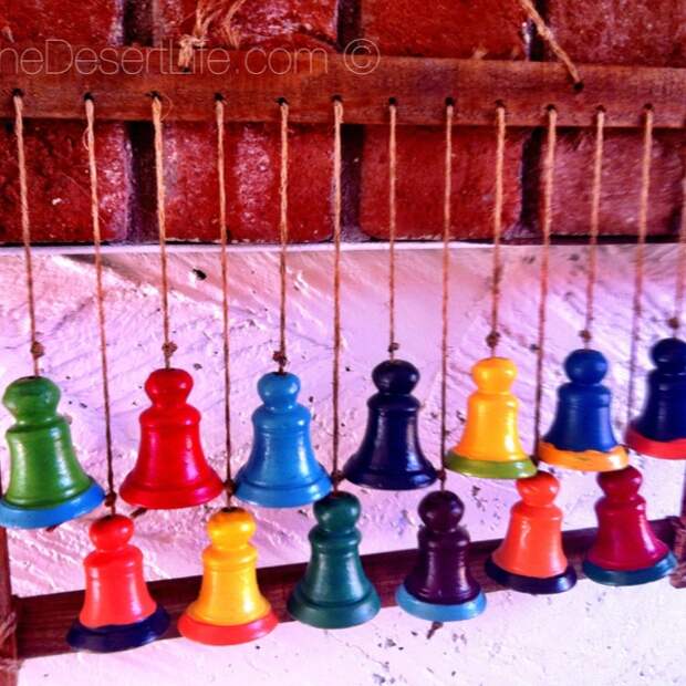 Painted these terra cotta bells in bright hacienda colors!