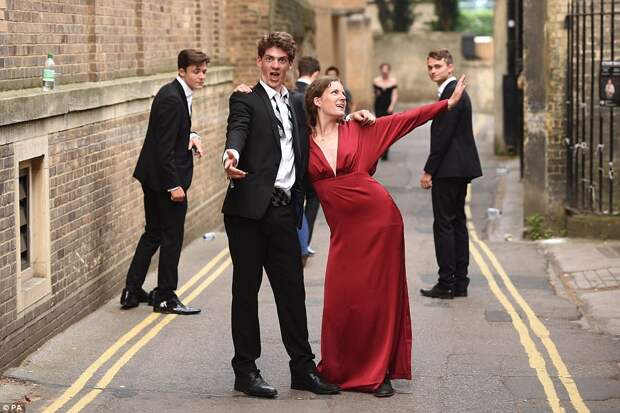 Students appear a little worse for wear as they lark about on their way home following the all-night spectacular