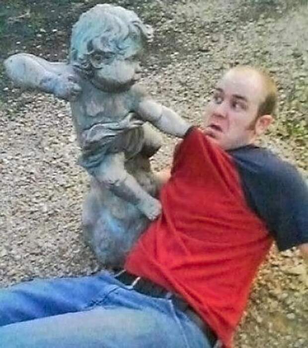b5e5daa0d87c0a9809a5f94170287702-cherub-statue-about-to-punch-guy-in-face