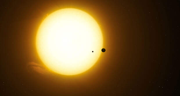 an illustration of a dark exomoon orbiting a bright Jupiter-sized planet