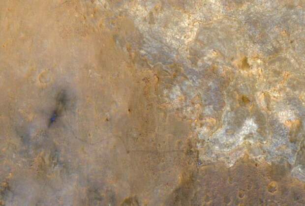 Curiosity appears as a bluish dot near the lower right corner of this enhanced-color view from Orbiter taken June 2013.