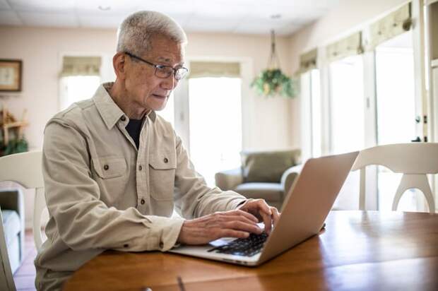 Person looking at laptop.