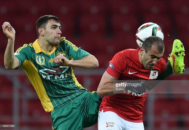 Yura Movsisyan (R) of FC Spartak Moscow is challenged by Igor Armash of FC Kuban Krasnodar during the Russian Premier League match between FC Spartak Moscow and FC Kuban Krasnodar at the Arena Otkritie Stadium on April 04, 2015 in Moscow, Russia.