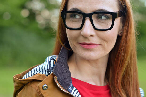 Tobacco-coloured waxed Barbour jacket, red t-shirt