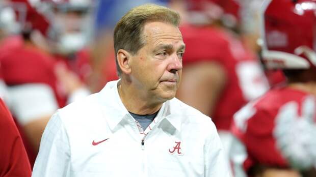 Nick Saban on the field before the SEC Championship Game.