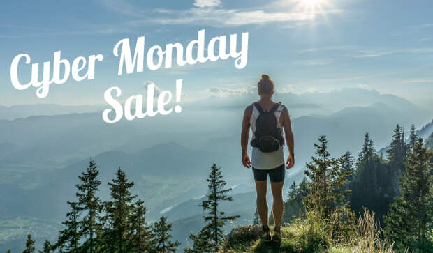 Girl backing packing on a mountain with a CYBER MONDAY SALE banner in the sky