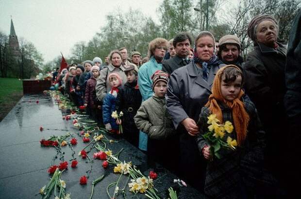 Crowds Leaving Flowers