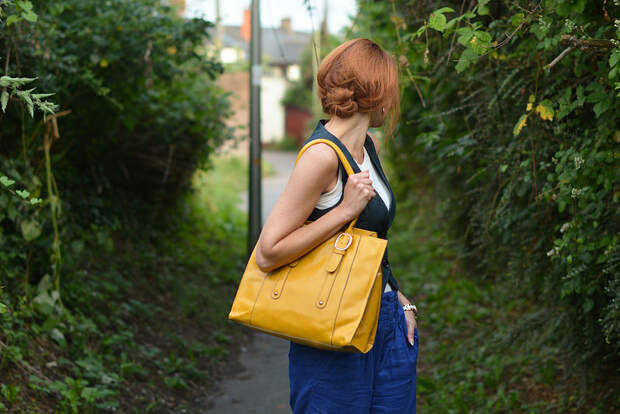 Not Dressed As Lamb: Vest/waistcoat with loose blue trousers, yellow tote