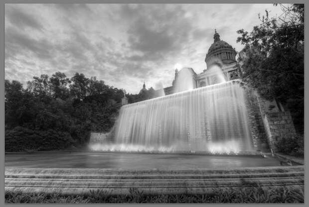 Photo of orante building and waterfall - black and white - desaturated