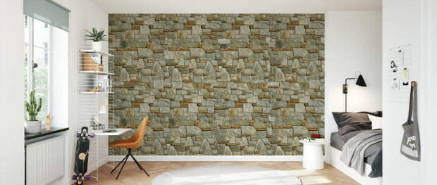 Каменная стена звучит выразительным акцентом в минималистическом дизайне комнаты. /Фото: images.photowall.com